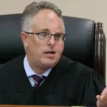 Judge Robert Hodges has facial scars